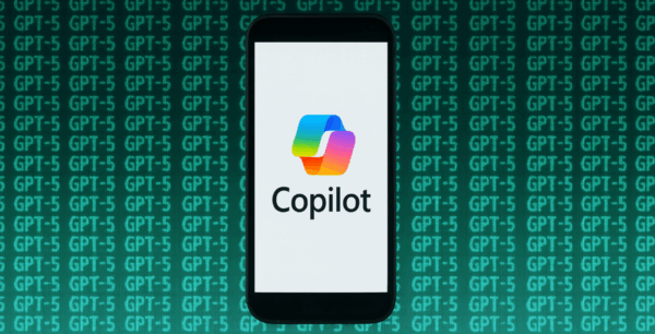 Phone with Copilot logo with GPT-5 code surrounding it